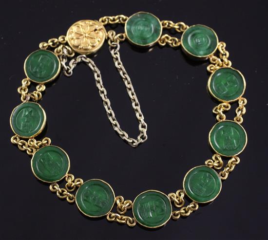 A Chinese high carat double chain link gold and jadeite bracelet, 6.5in.